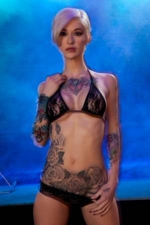 Hot tattooed Kleio Valentien sheds black lace panties to squat & spread legs on galpictures.com