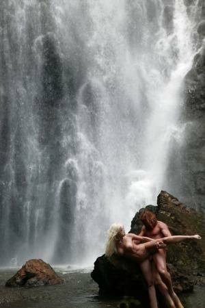 Stunning milf Jesse Jane fucks outdoor in the waterfall on cam on galpictures.com