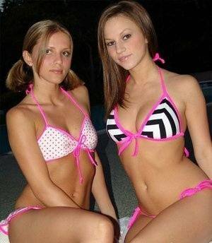 Young lesbians take off their bikinis in a safe for work manner at night on galpictures.com