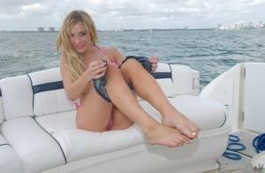 Lusty blonde Amy Brooke strips bikini and rubs pussy on the boat on galpictures.com