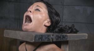Restrained brunette London River is forced to suck a black penis on galpictures.com