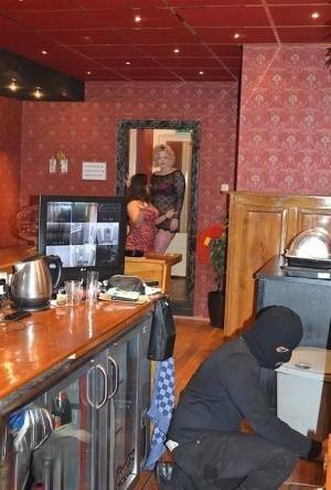 Amateur chick Kimberly Scott and a girlfriend disrobe a hooded male robber on galpictures.com