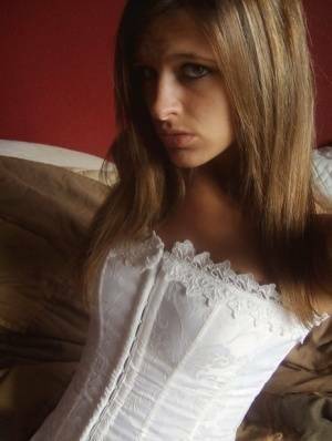 Teen in white corset and tight panties showing off her perfect tight body on galpictures.com