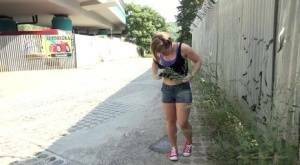 White girl pulls down her panties before squatting for a piss on country road on galpictures.com