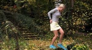 Cute blonde Victoria Pure hikes her skirt to take a pee along country lane on galpictures.com