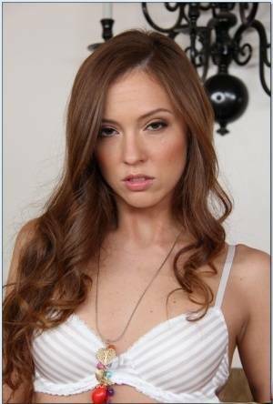 Pretty babe Maddy O'Reilly stripping and exposing her shaved slit on galpictures.com