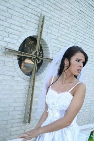 MILF babe in bride's dress Jennifer Dark spreading pussy on galpictures.com