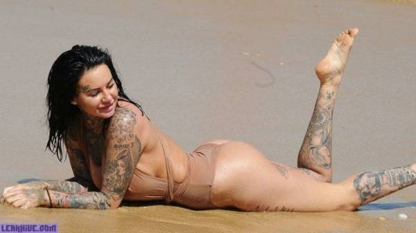 Jemma Lucy showing her ass and cleavage on the beach on galpictures.com