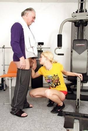 Young fitness chick in pigtails sucks off a much older man's cock on galpictures.com
