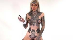 Tattoo enthusiast Amber Luke rides a multispeed sex machine on galpictures.com