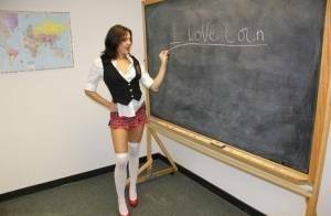 Naughty schoolgirl Cherry Poppins seduces a fellow student in slut wear on galpictures.com