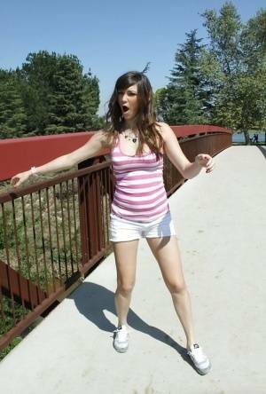 Flexible babe in shorts Holly Michaels shows her sports body outdoor on galpictures.com