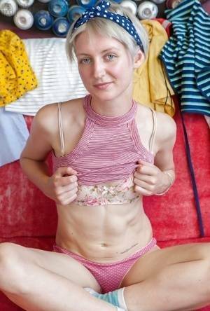 Short haired amateur Poppy B loosing tight ass from pink panties on galpictures.com