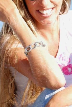Amateur model Lori Anderson shows off her hairy arms while fully clothed on galpictures.com