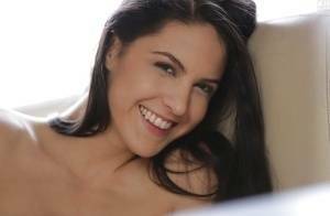 Latina pornstar Carolina Abril strips off her white bra and panties on galpictures.com