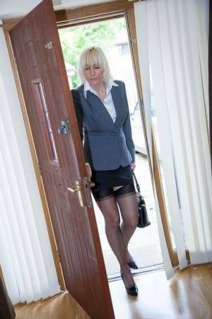 Older MILF Jan Burton strips off business clothes after a hard day at office on galpictures.com