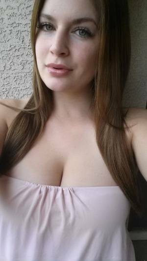 Plump amateur Danielle takes topless and clothed selfies around the house on galpictures.com