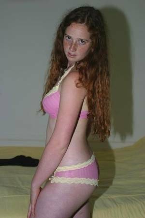 Flexible redhead Rachel showcases her natural pussy after lingerie removal on galpictures.com
