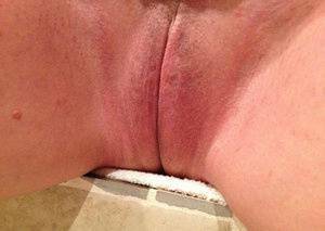 Older amateur Busty Bliss finger spreads her pink vagina after showering on galpictures.com