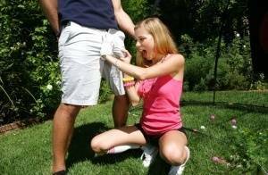 Young blonde girl Nicole Ray giving large dick oral sex outdoors on lawn on galpictures.com