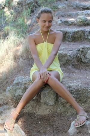 Cute teen Mango A in mini dress spreading outdoors for closeup of bald twat on galpictures.com
