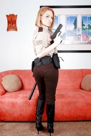 Hot babe in police uniform Krissy Lynn stripping and spreading her legs on galpictures.com