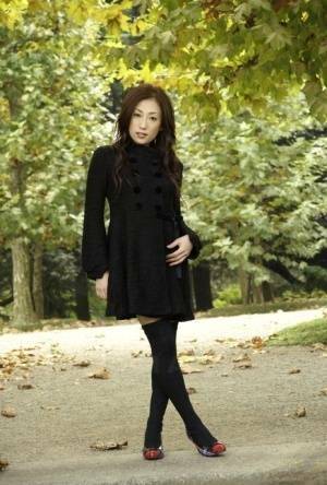 Fully clothed Japanese teen models in the park in black clothes and stockings - Japan on galpictures.com