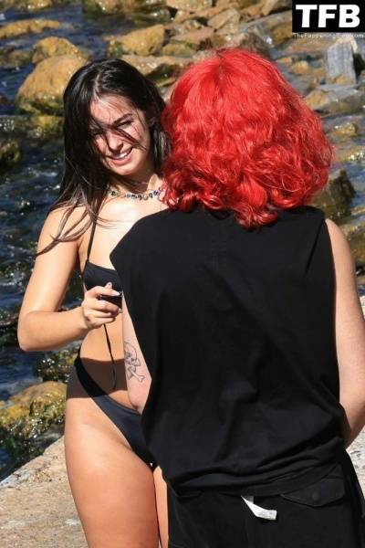 Addison Rae Displays Her Curves in a Black Bikini on Holiday with Omer Fedi on Lake Como on galpictures.com