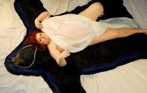 Fat redhead Black Widow AK models totally naked on a bearskin rug on galpictures.com
