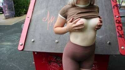 Public flashing in a park with people around on galpictures.com